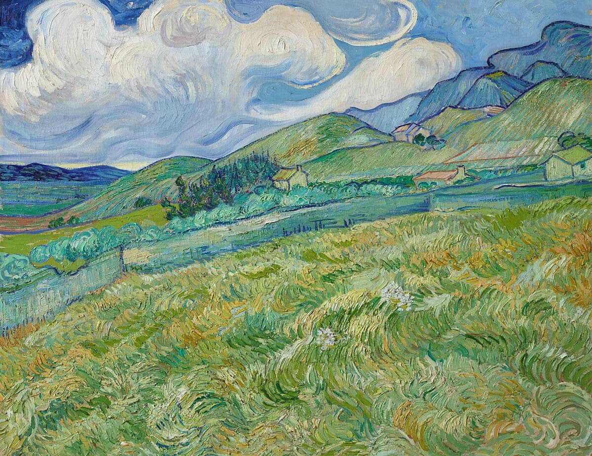 This painting captures the undulating hills and dynamic skies of Saint-Rémy, where Van Gogh spent time. The green fields and distant mountains are painted with swirling, layered strokes, creating a dreamlike atmosphere.