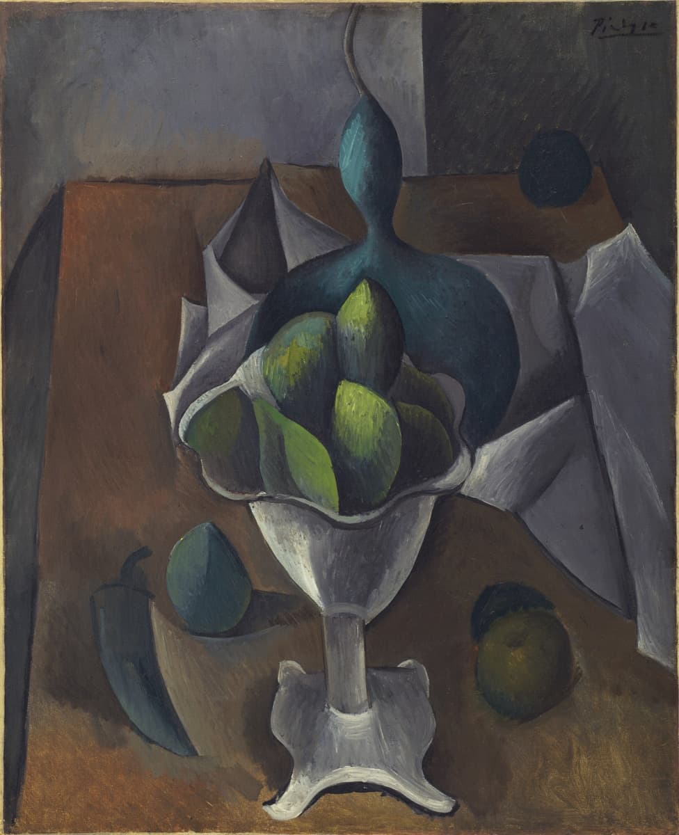 A cubist still life featuring a white, pedestal fruit bowl holding green fruits, with additional fruits scattered around the base. The background is abstract, with folds of white cloth and geometric forms in brown and grey tones. The shapes of the fruits and the bowl are slightly distorted, characteristic of the cubist style, giving the scene a fragmented and multi-dimensional appearance.