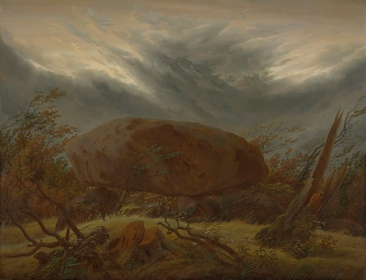 A massive dolmen-like boulder rests amid windswept autumn trees under a turbulent sky. The scene feels ancient and brooding, charged with the mystery of nature and time.