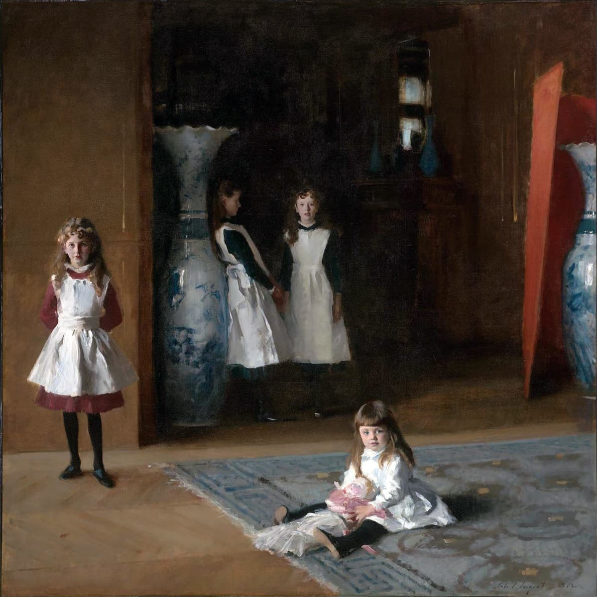 A group of four young girls in Victorian-era clothing stand and sit in an elegant interior. Three girls wear dark dresses with white pinafores, and one girl in the foreground sits on a carpet holding a doll. The background features oversized vases and dim lighting, giving the scene a quiet, formal atmosphere.
