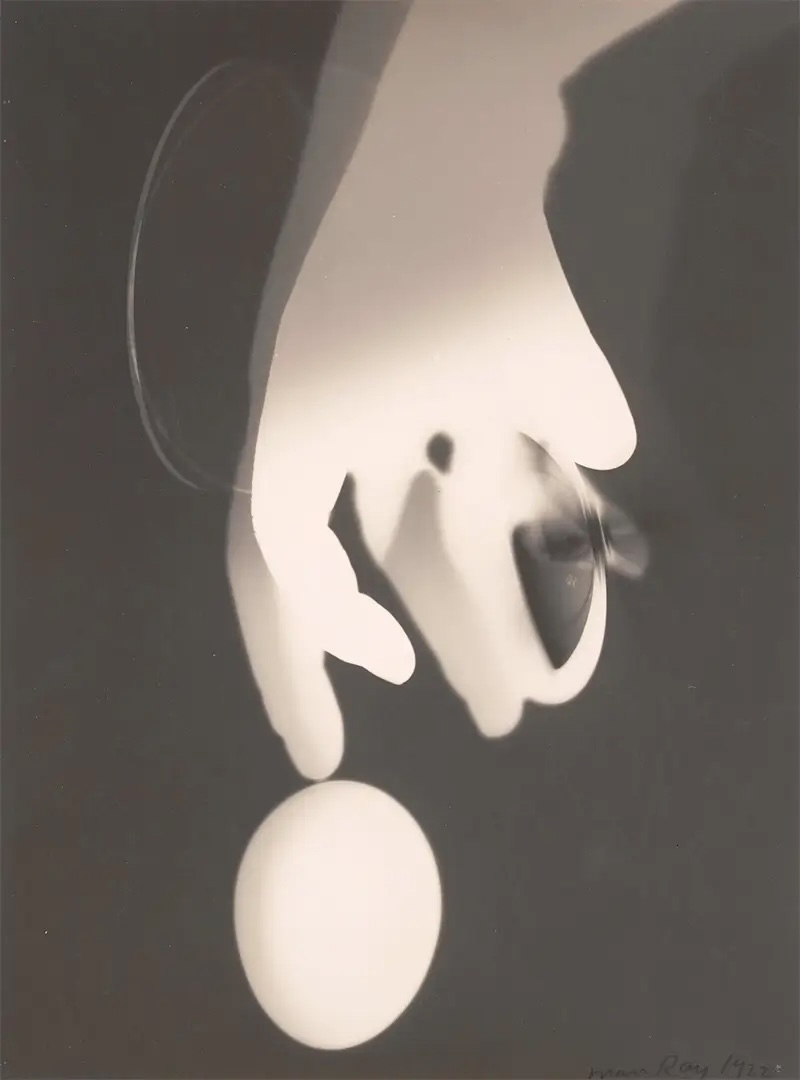 Surreal abstract shapes in pale tones forming a ghostly, organic silhouette, with a glowing oval form beneath and shadowy contours suggesting movement and depth.